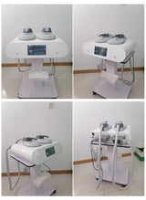 Handheld dual paddles for EMS sculpting machine – closeup view showing build quality and connector hoses.