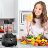 Woman enjoying fresh juice beside BioloMix high power blender and fruit