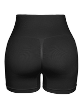 black seamless high-waist butt-lifting cycling shorts for women, breathable and form-fitting for gym workouts.