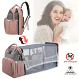 Fold-out crib attached to diaper bag with breathable mosquito-net canopy; anti-sun and anti-mosquito use case.