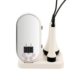 RF EMS facial and body device with digital timer and two treatment handles on charging base