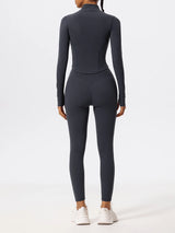 Back view of dark blue Hearuisavy yoga jacket showing contoured seams and fitted waist