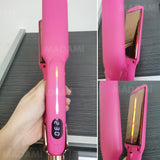 Close-up of pink titanium flat iron showing 230°C on LED temperature display