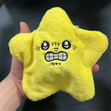Close-up view of yellow angry star plush toy with gritted teeth and expressive embroidered face