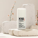 K18 Leave-In Hair Mask 50ml on soft white decorative stone background