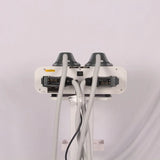 Rear view showing connectors, power switch, and flexible hoses docks