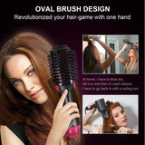 Woman using oval brush to dry, straighten, and add volume in one step with 3-in-1 styling tool