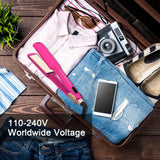 Neon pink flat iron packed inside suitcase for travel with dual voltage label