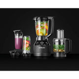 Front view of 1500W blender base with digital controls, pitcher, processor bowl, and travel cups