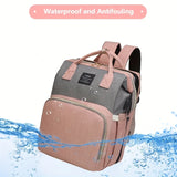 Waterproof, antifouling diaper backpack in pink and gray with water droplets on the fabric.