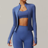 Woman wearing blue zip fitness yoga jacket long sleeve activewear top front view