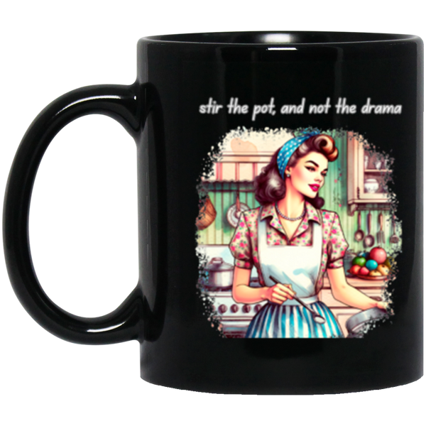 Black mug with a graphic the drama' on a white background.