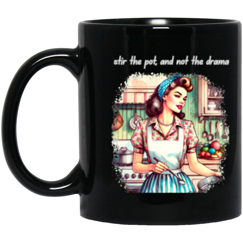 Black mug with a graphic the drama' on a white background.