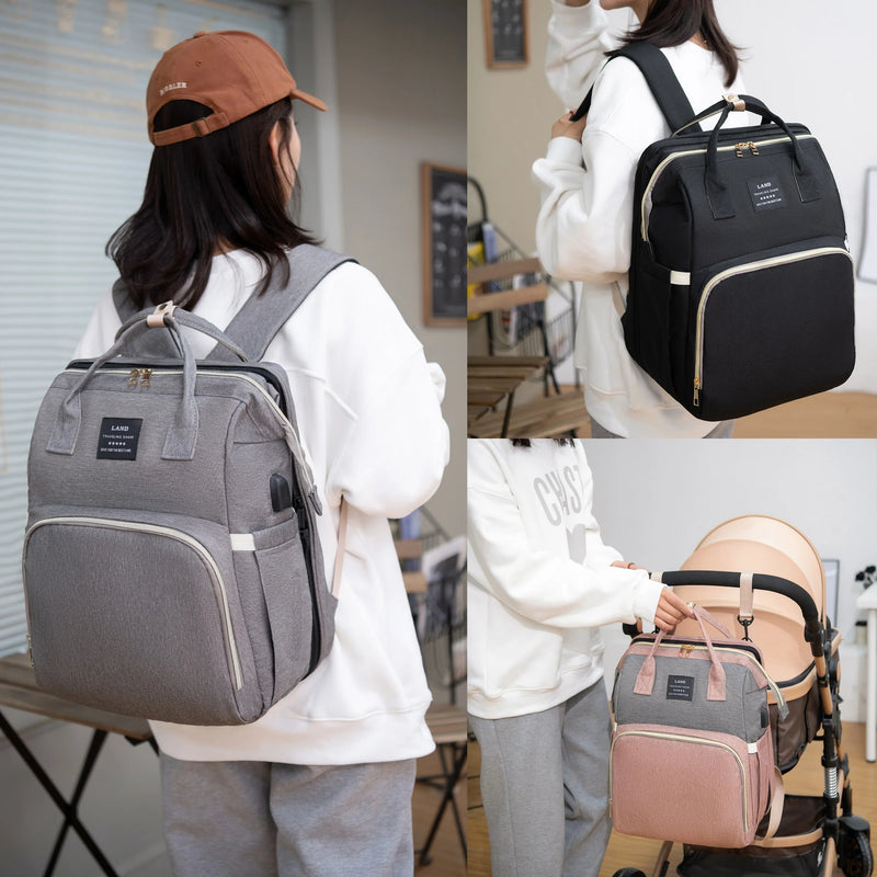 Lifestyle views of diaper backpack in gray and black—worn on back and attached to stroller handle.