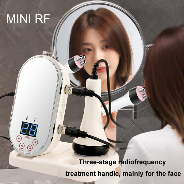 Mini RF & EMS radio frequency skin tightening machine with face probe next to mirror