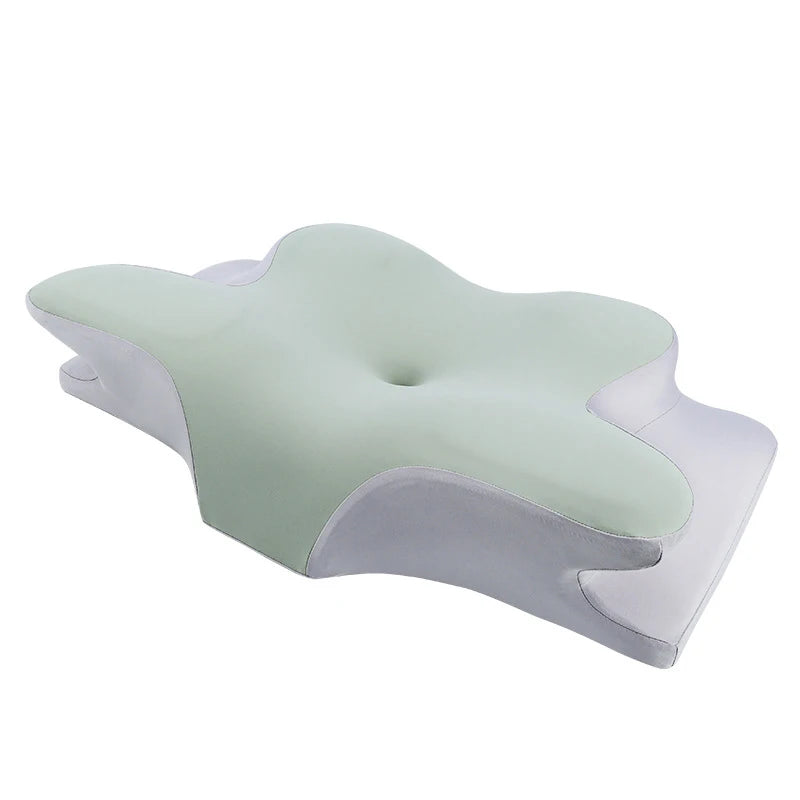 Mint green and white ergonomic foam pillow with soft contours for improved sleep posture

