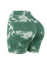 green tie-dye seamless high-waist yoga shorts for women with push-up and compression support.