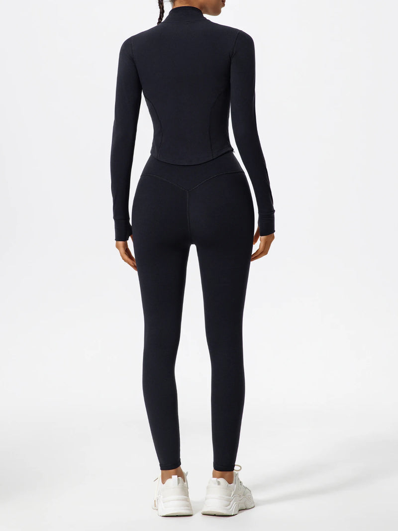 Back view of black Hearuisavy yoga jacket with curved seam detail and long sleeves