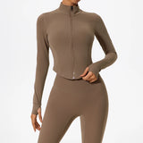 Brown Hearuisavy yoga jacket showing soft stretch material and curved seams