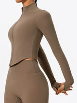 Side view of brown Hearuisavy yoga jacket showing flexible stretch fabric and long sleeves