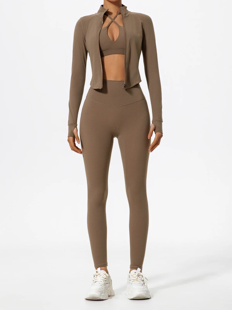 Brown Hearuisavy yoga jacket worn open over matching sports bra and leggings