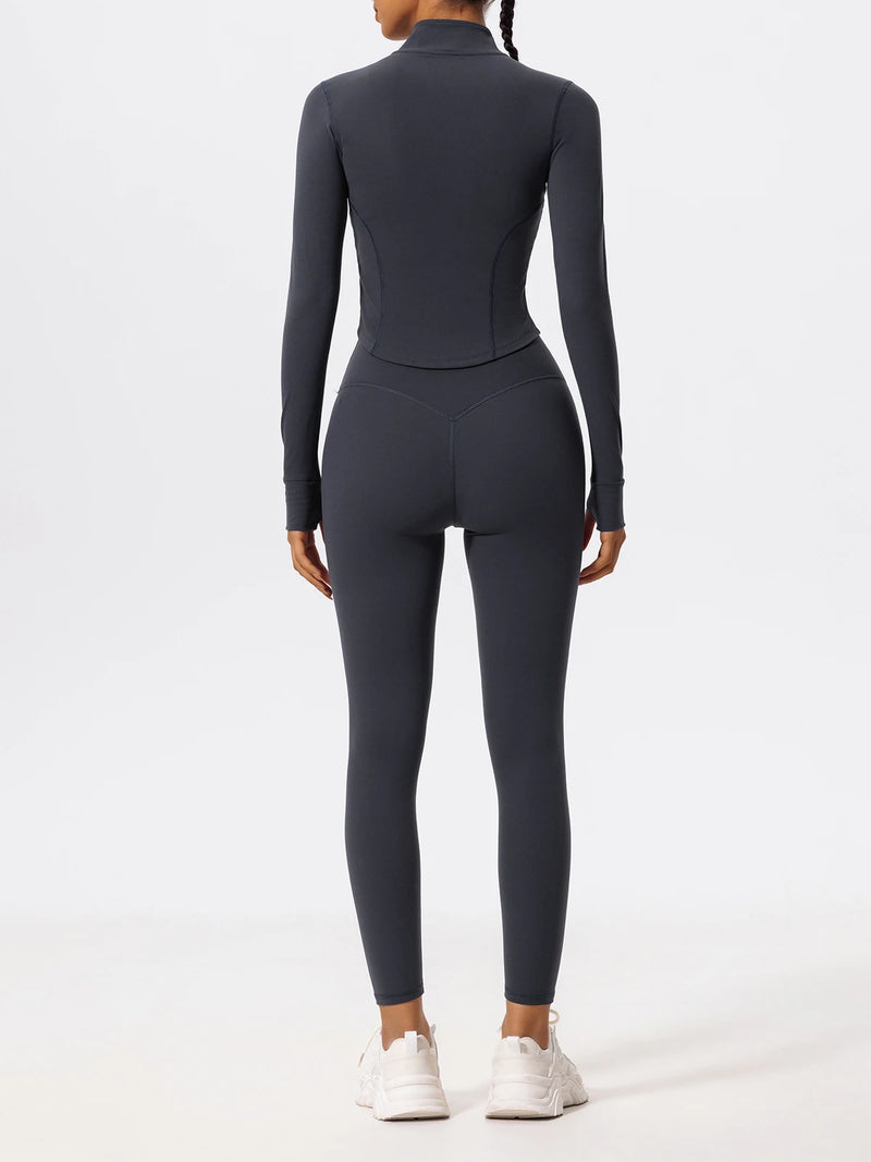 Back view of dark blue Hearuisavy yoga jacket showing contoured seams and fitted waist