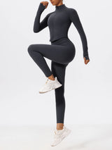: Full-body view of woman in dark blue Hearuisavy yoga jacket and leggings set