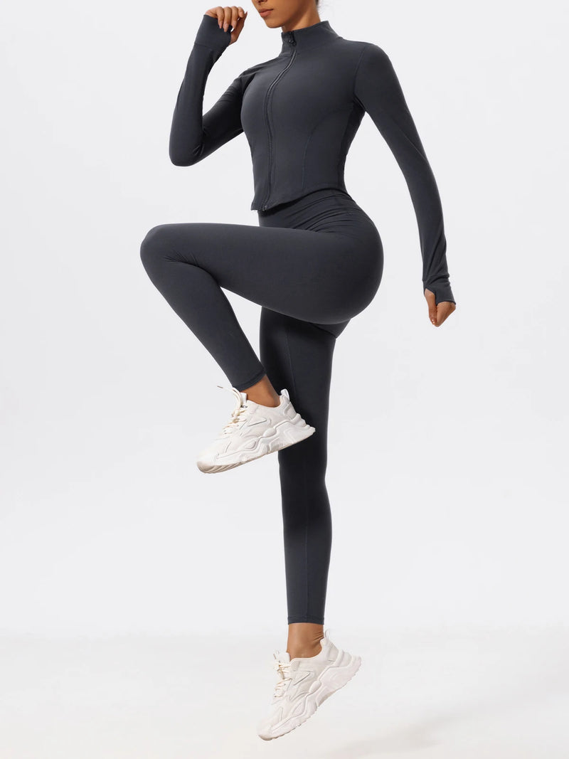 : Full-body view of woman in dark blue Hearuisavy yoga jacket and leggings set
