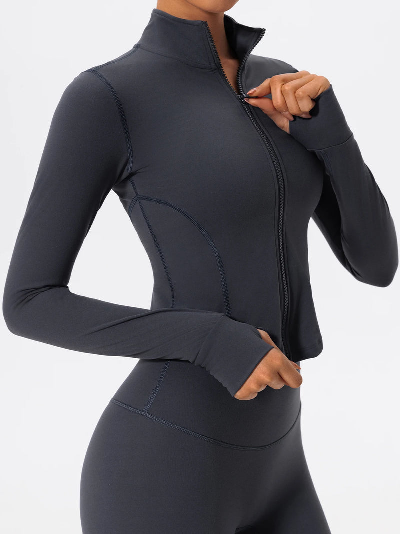 Woman wearing dark blue Hearuisavy yoga jacket zipping up front closure