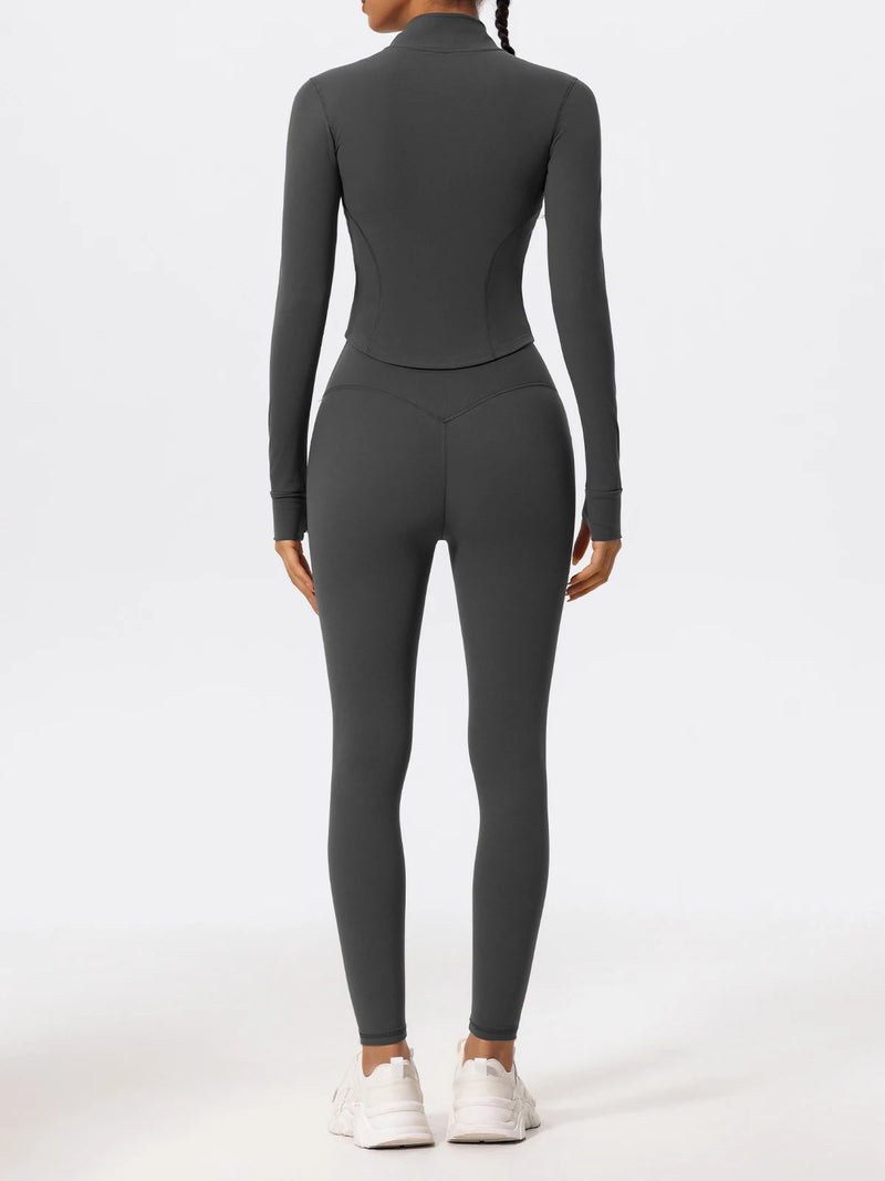 Back view of gray Hearuisavy yoga jacket highlighting sculpted seams and long sleeves