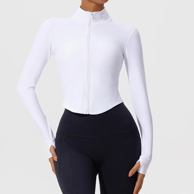 Model wearing white Hearuisavy yoga jacket with long sleeves and thumbholes