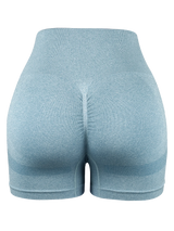 light blue seamless high-waist compression shorts for women with push-up butt-lifting design and stretch fabric.