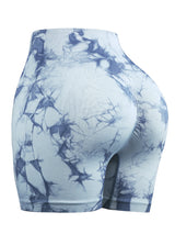 light blue tie-dye seamless cycling shorts with high waist and push-up fit for women’s gym and workout outfits.
