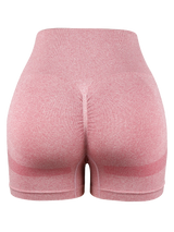 pink seamless high-waist cycling shorts with ruched butt-lift design for women’s gym and workout outfits.