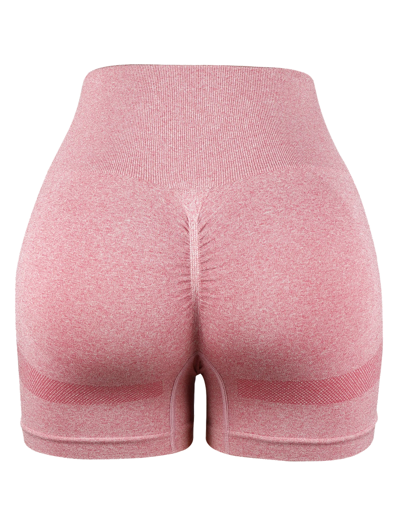 pink seamless high-waist cycling shorts with ruched butt-lift design for women’s gym and workout outfits.