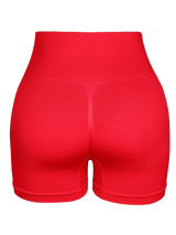 red seamless butt-lifting cycling shorts with high waistband for women’s fitness, yoga, and gym routines.