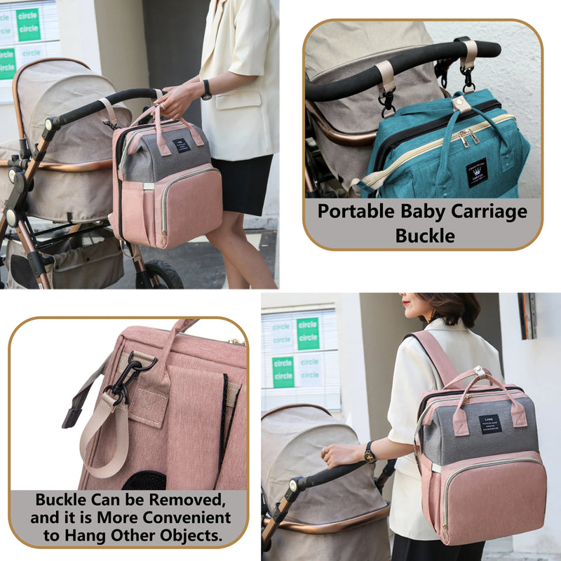 Diaper backpack clipped to stroller with removable buckles and worn as a backpack for hands-free carrying.