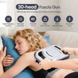 Using the 30-head fascia gun on shoulders and back—high-frequency vibration plus red-light irradiation for deep relaxation.