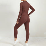 Back view of brown 2-piece yoga outfit featuring long-sleeve zip jacket and leggings.