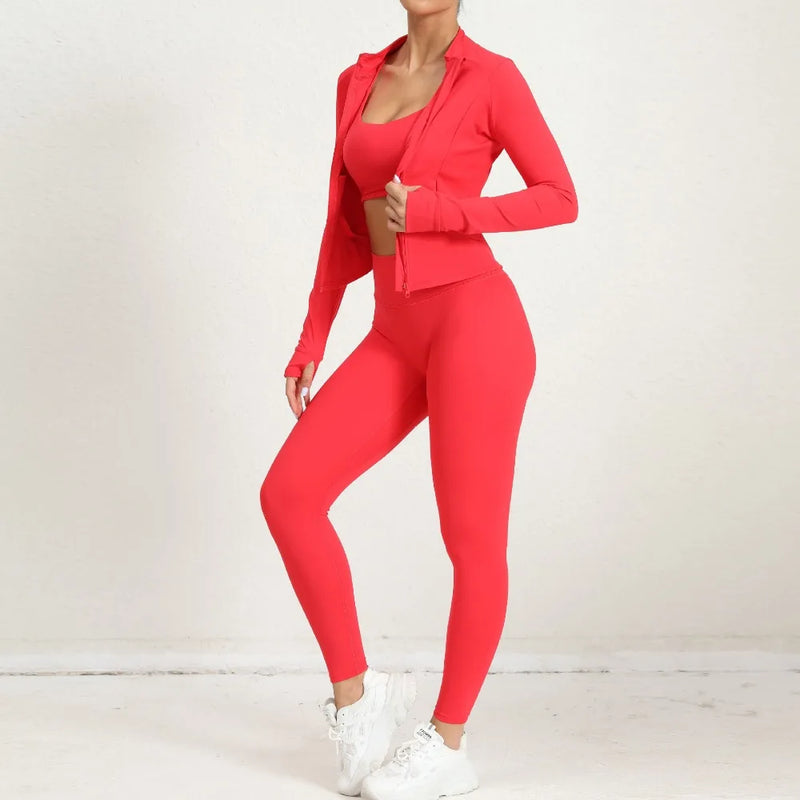 Red 2-piece yoga set with open zip jacket and leggings, side angle pose.
