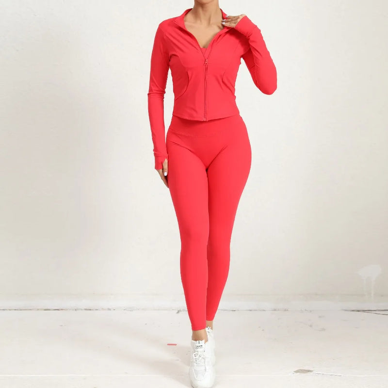 Woman wearing red 2-piece yoga set with zip jacket and high-waist leggings, front view.